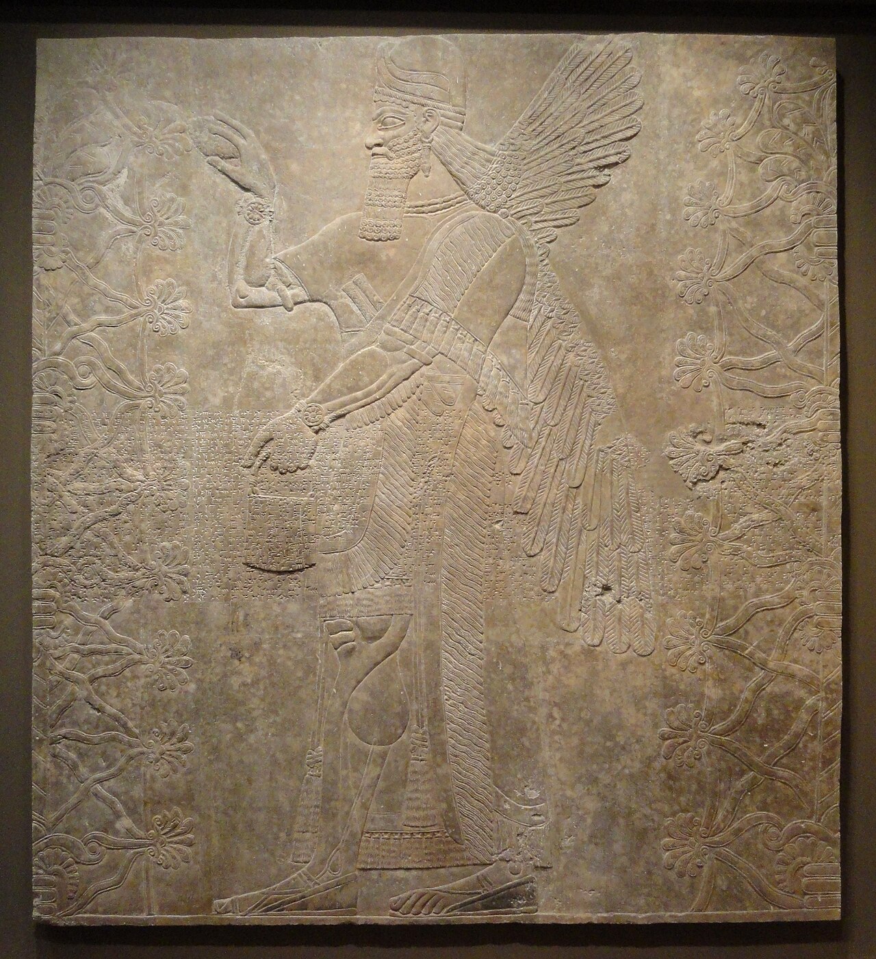 Ancient Assyrian carved stone relief in a museum